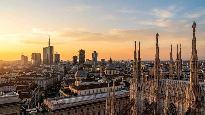 Milan skyline with modern towers seen beyond the Duomo's marble rooftop pinnacles